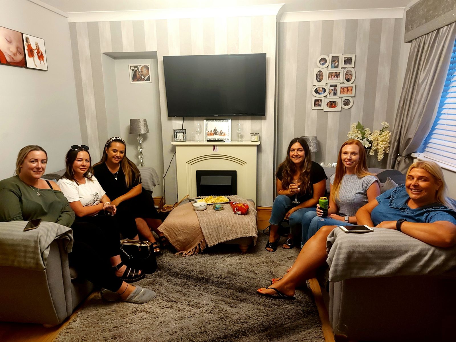 Friends relaxing on sofas with snacks at an Audience evening