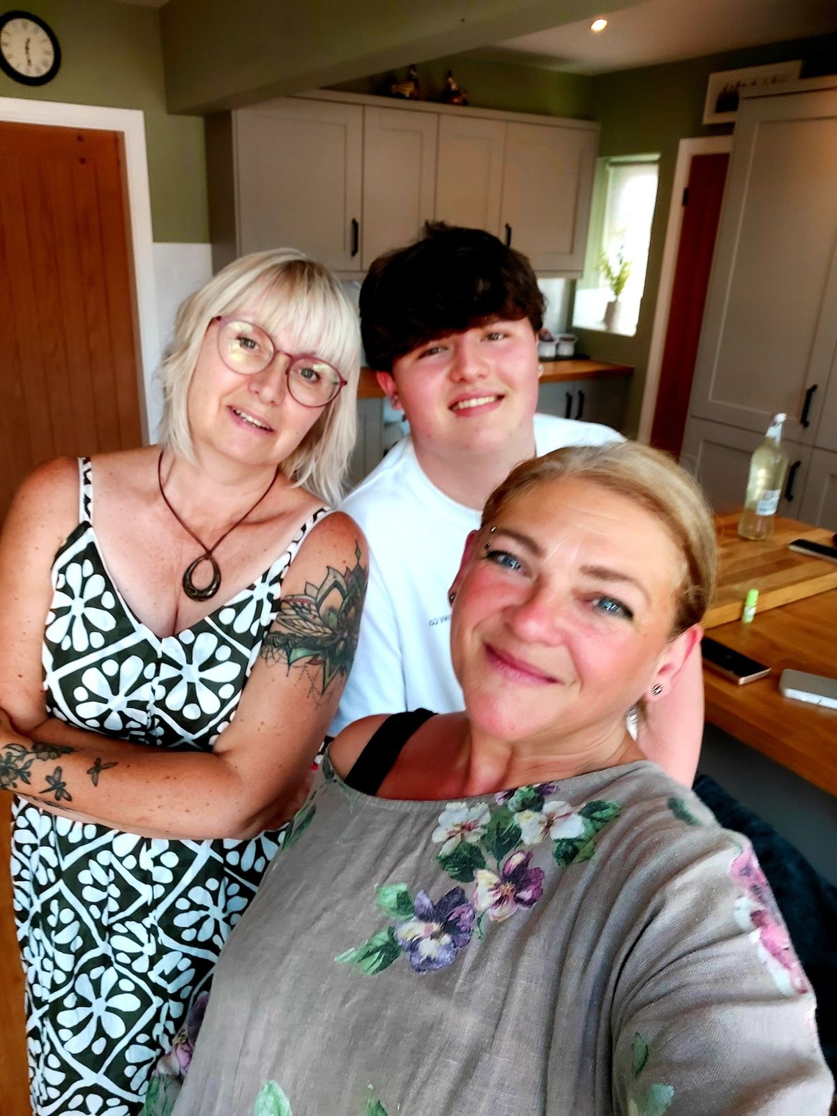 Nikki with friends in a kitchen after a session